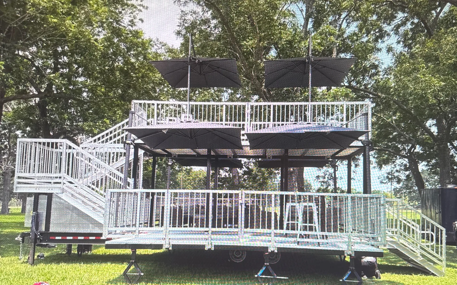 The Nest VIP front view with upper deck, cantilever umbrellas and stair access